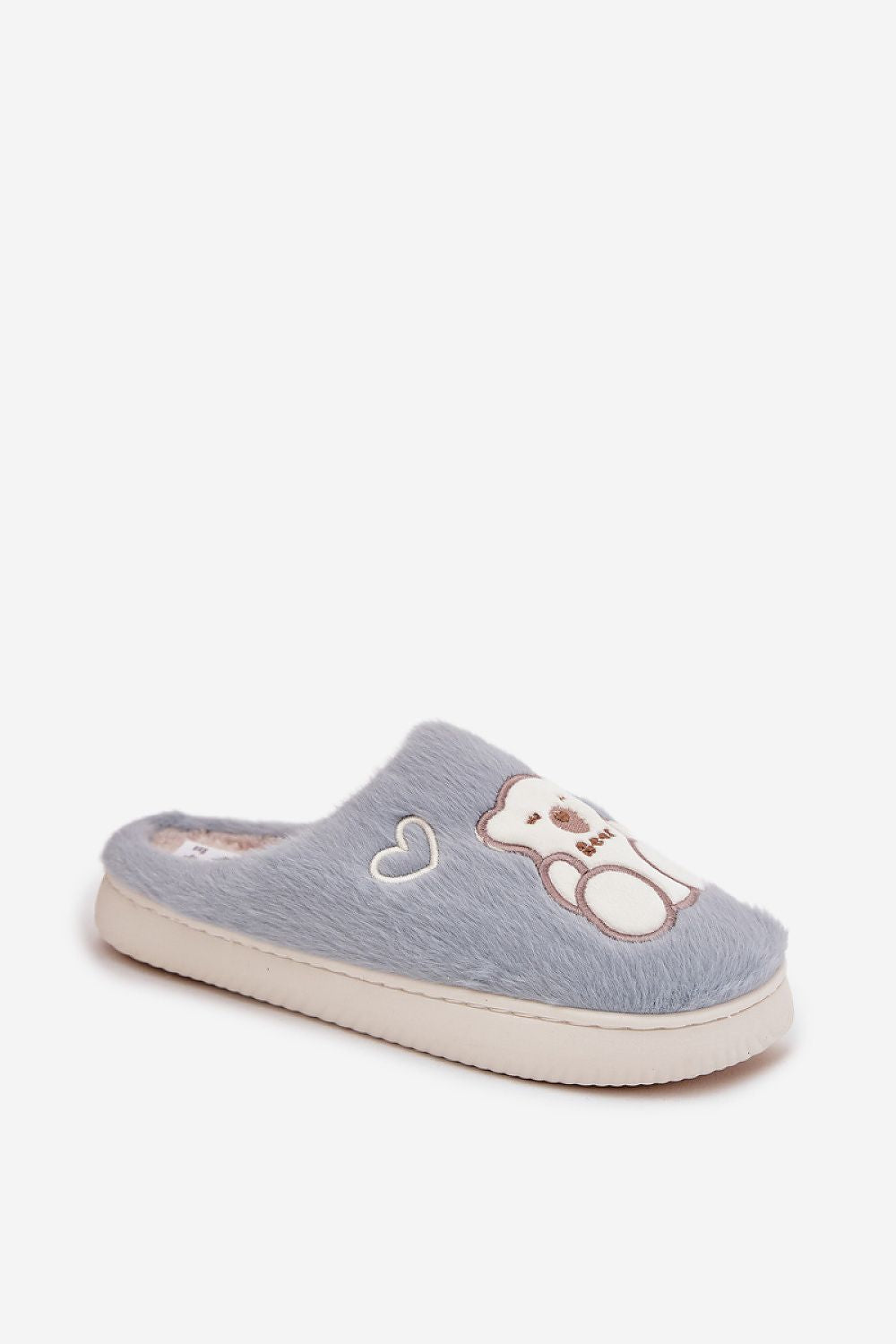 Step in style luxury fluffy slippers displayed with a cozy home setting, perfect for warm, stylish indoor relaxation.