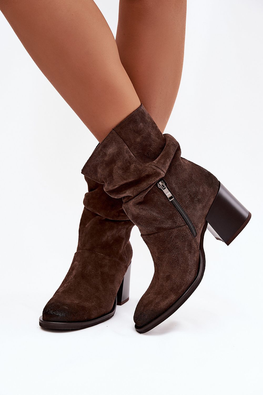 Stylish outfit featuring Elegant Women's Suede Ankle Boots by Step in Style, demonstrating versatility for both day and evening wear.