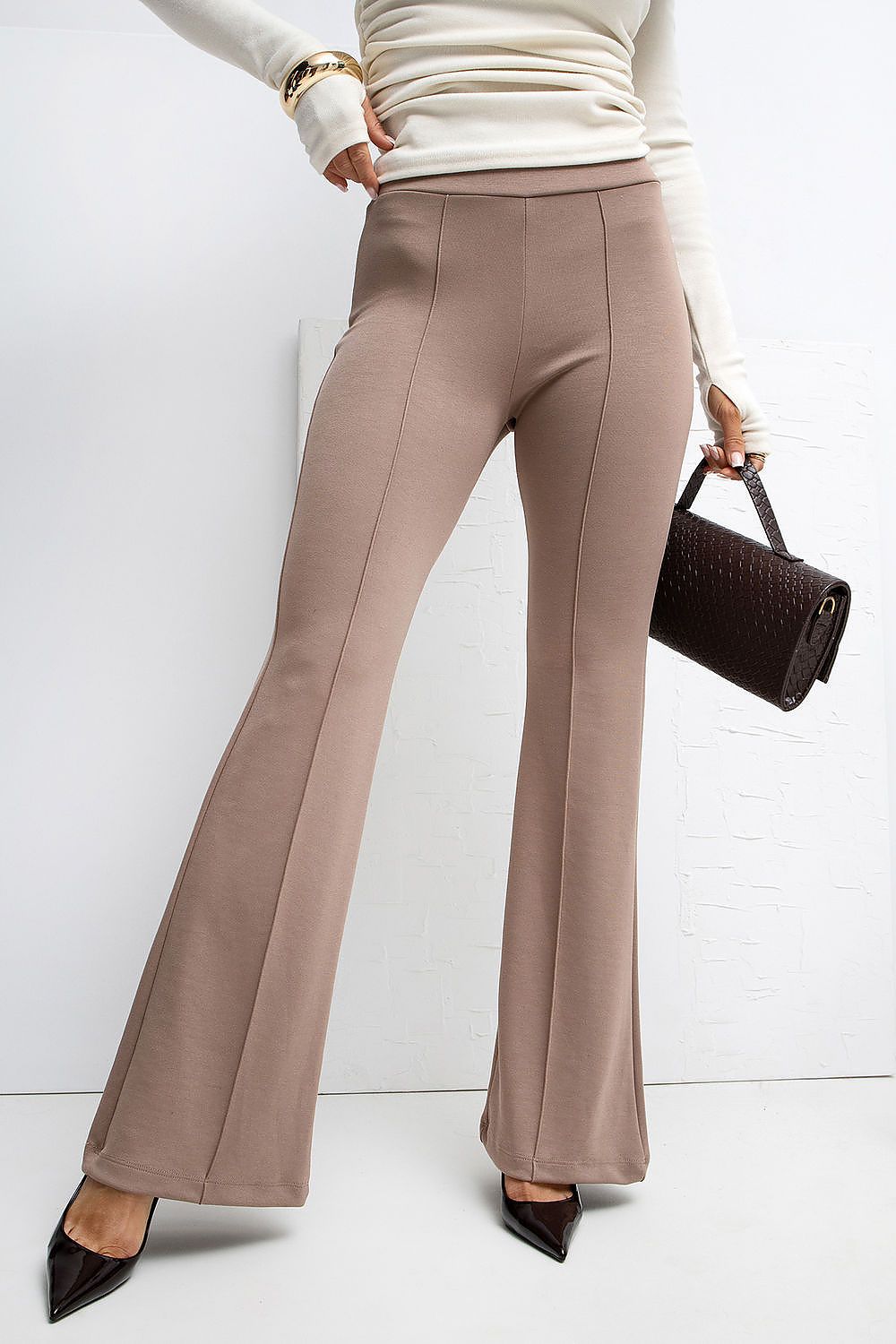 Close-up view of Rue Paris High Waist Flared Tracksuit Trousers highlighting decorative front seams for a refined silhouette.