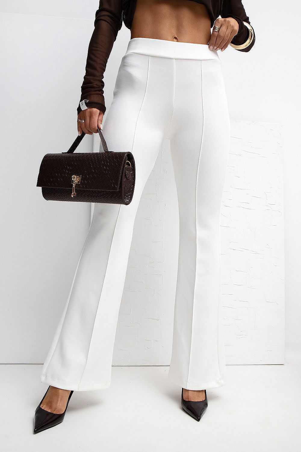 Stylishly detailed Rue Paris High Waist Flared Tracksuit Trousers highlighted with elegant flared legs for a chic silhouette.