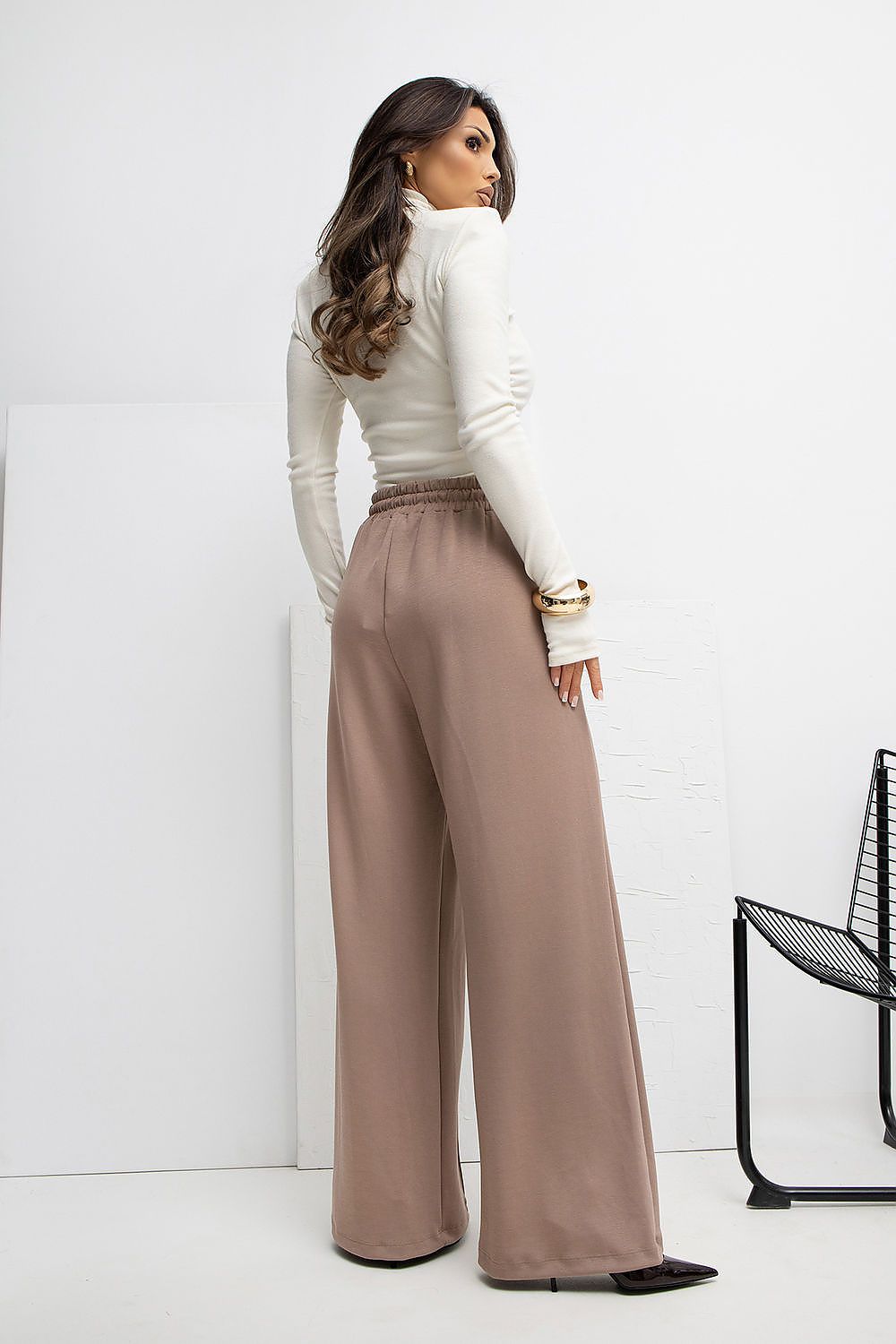 Functional design of Rue Paris high-waist palazzo sweatpants with practical side slip pockets.