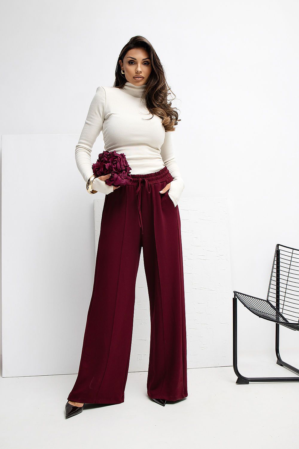Model wearing Rue Paris Luxury High-Waist Palazzo Sweatpants, styled for chic loungewear with a fitted top to enhance the elegant silhouette.