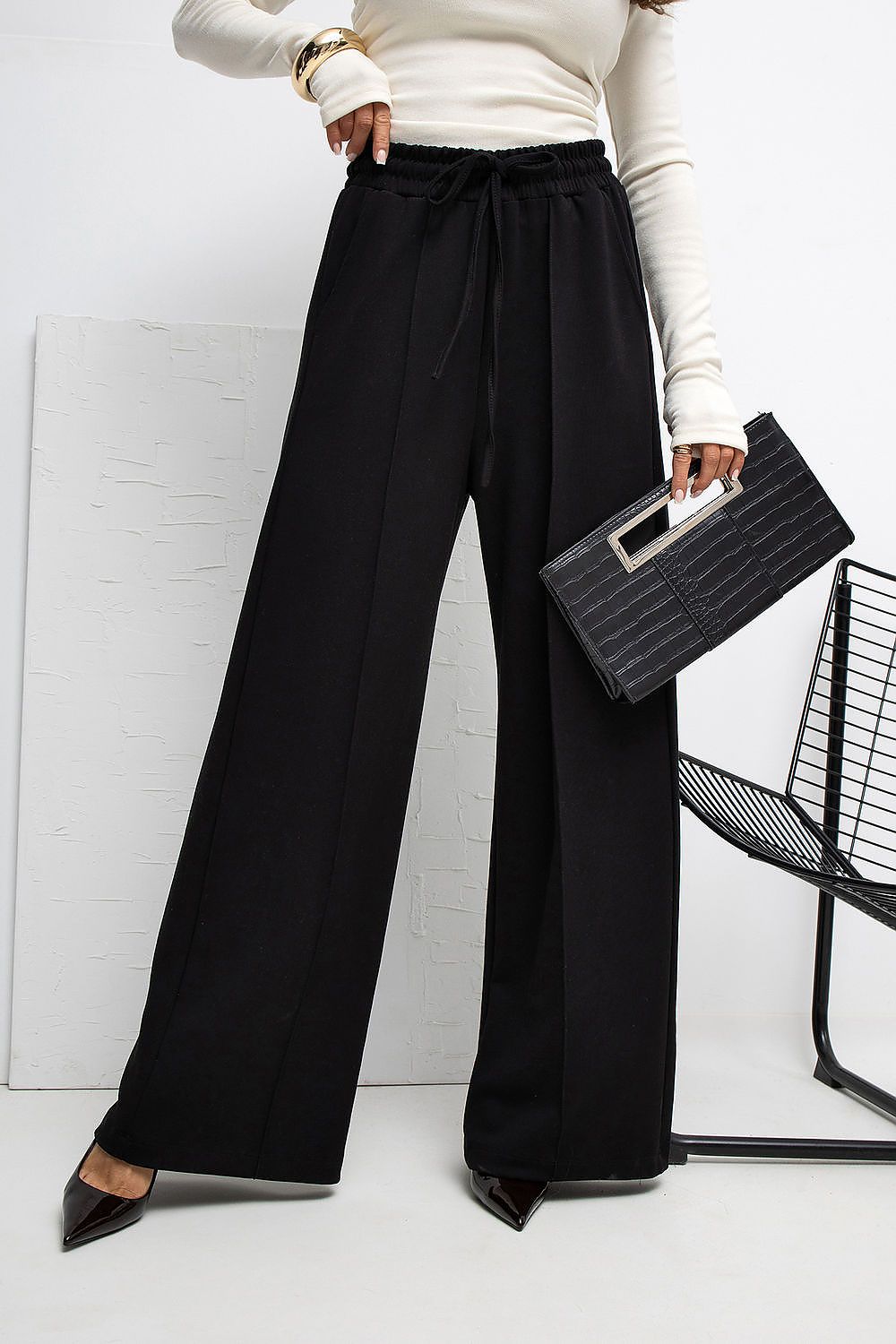 Side view of Rue Paris Luxury High-Waist Palazzo Sweatpants, displaying the comfortable tie waist and practical side slip pockets in a luxurious design.