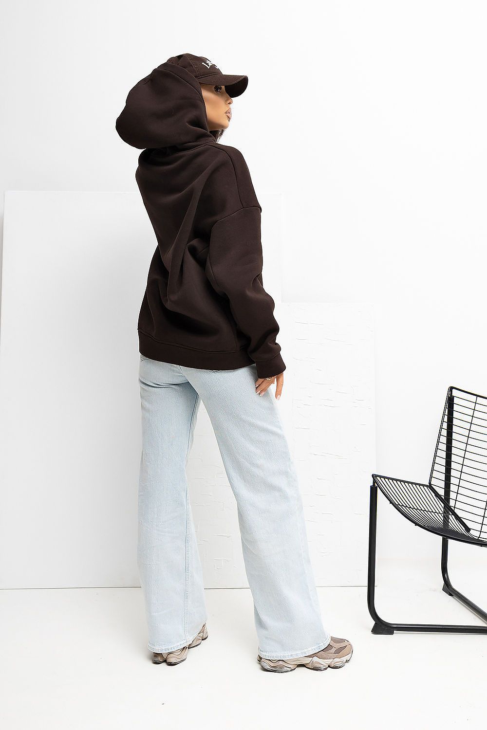 Comfortable Women's Hoodie Sweatshirt by Rue Paris on display, highlighting its long sleeves and sporty hood, designed for elegance and functionality.