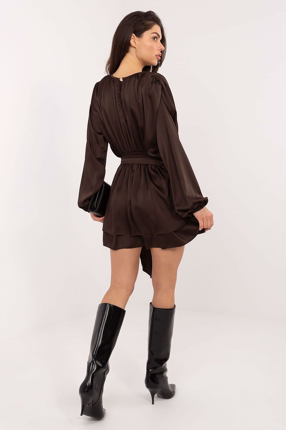 Side view of the Elegant Italy Moda Jumpsuit featuring the stylish tie waist and ruffled skirt insert, exuding timeless elegance and femininity.