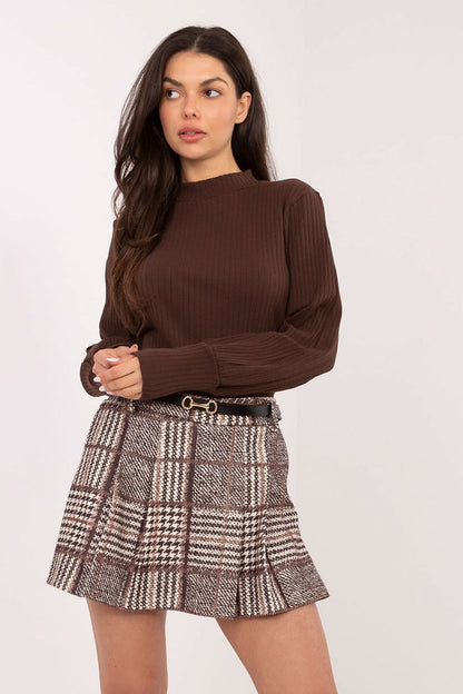 Model wearing the Elegant Plaid Skort by Italy Moda in a fashionable setting, highlighting its versatility for both casual and formal occasions.