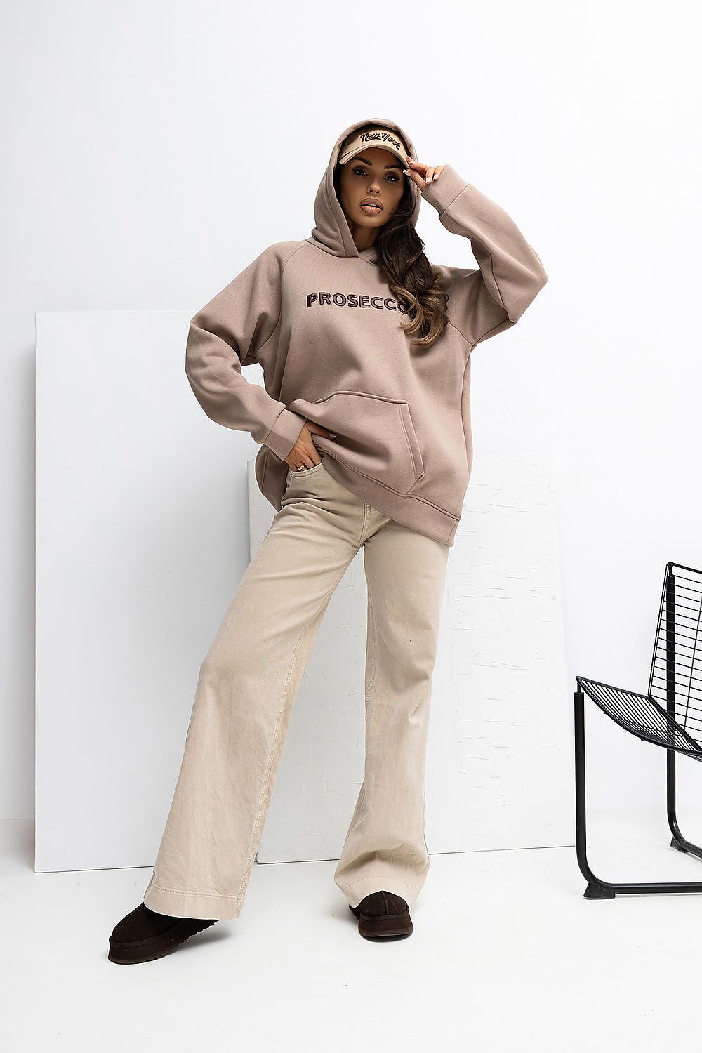 Elegant women's hoodie sweatshirt by Rue Paris showcasing a relaxing fit and stylish embroidered inscription, ideal for casual outings.