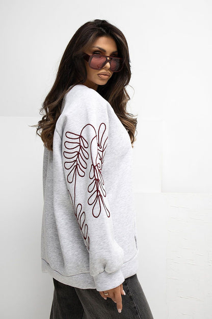 Elegant Women's Casual Sweatshirt from Rue Paris showcasing a soft cotton blend, ideal for modern women seeking comfort and chic style, complete with stylish embroidered details.