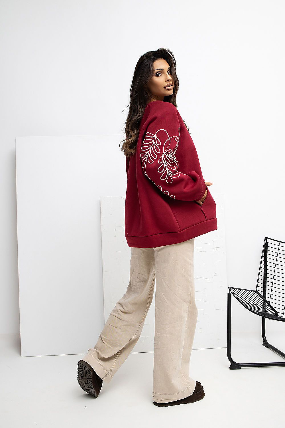 Flat lay of Rue Paris Women's Embroidered Casual Sweatshirt, emphasizing the stylish round neckline, kangaroo pocket, and soft fabric ideal for comfort and elegance.