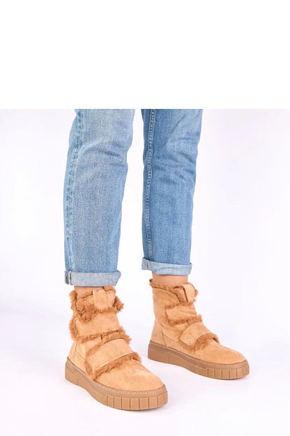 Solea luxurious Eco Suede fur-lined boots showcasing elegant design and practical Velcro fastening in a winter setting.