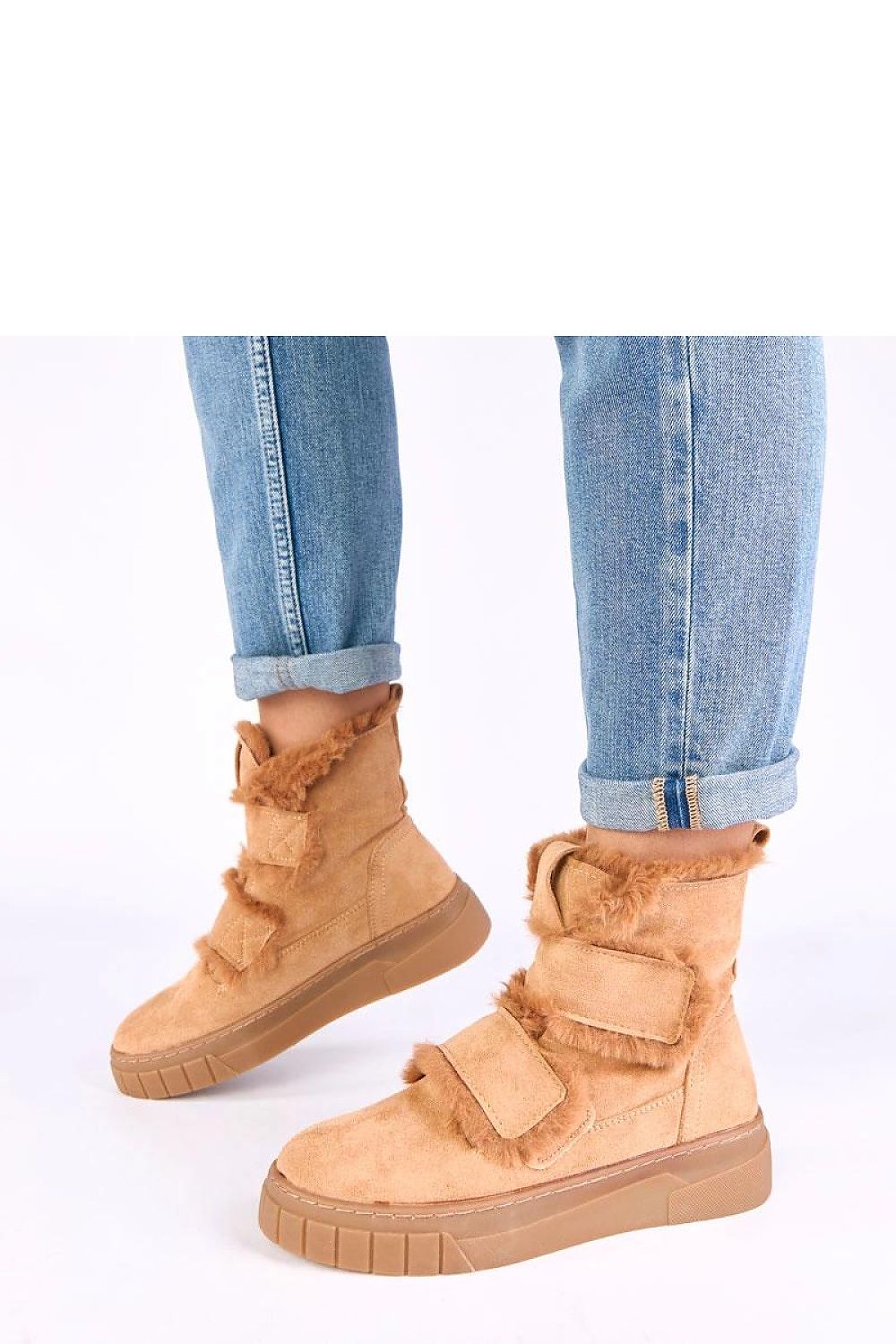 Stylish Solea eco-friendly fur-lined boots displayed in a fashionable outdoor environment, perfect for cold weather.