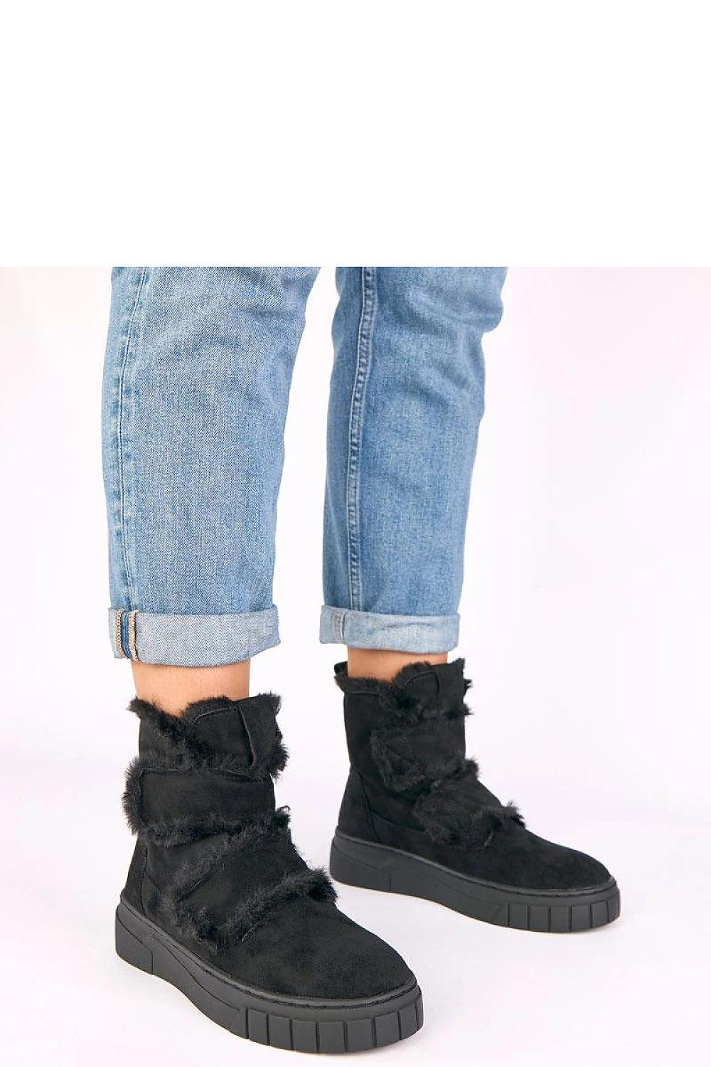 Solea luxurious fur-lined boots featuring soft eco suede and a chic round toe design, ideal for winter elegance.