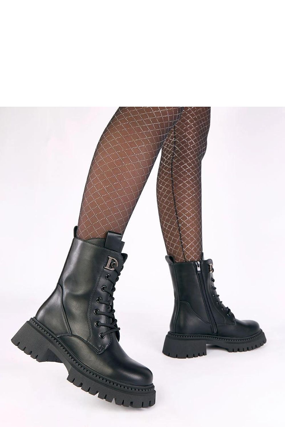 Close-up of Solea's luxurious platform ankle boots featuring dazzling zircon accents, designed for elegance and comfort, ideal for any fashionable outfit.