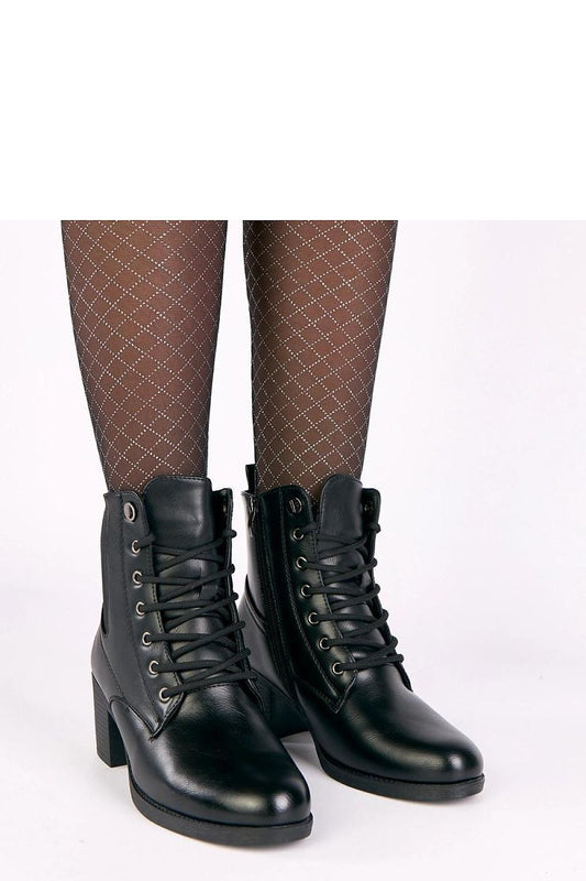 Solea eco-leather heel boots featuring an elegant design with elastic insert and lacing, showcasing a versatile style perfect for modern women.