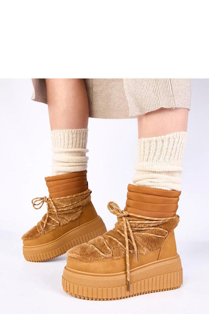 The Luxury Solea Laced Snow Boots With Fur displayed on a snowy background, exemplifying winter style while maintaining comfort and luxury.