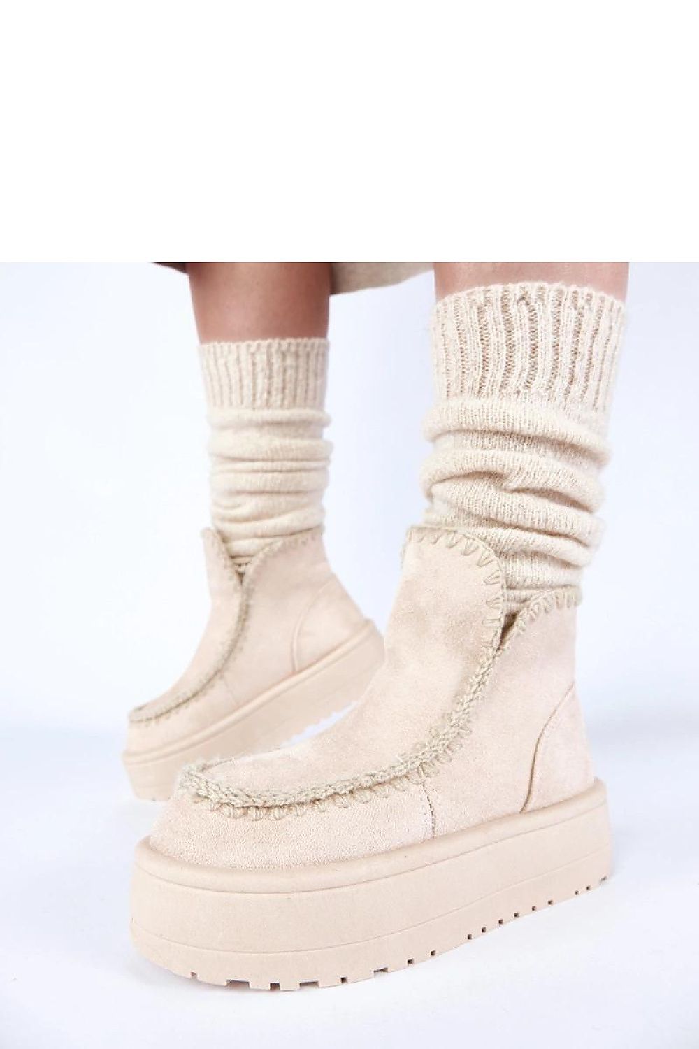 Solea Snow Boots displayed in a winter setting, highlighting the 10cm high shaft and soft lining for warmth and comfort.