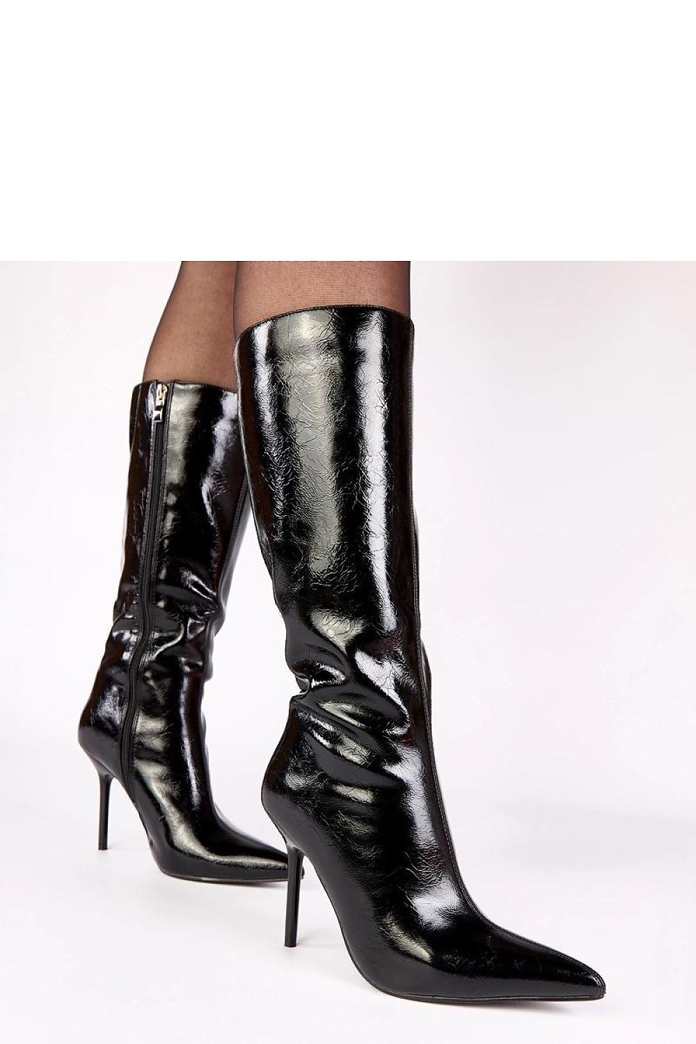 Solea Women's Polished Patent Leather Heel Boots displayed with a sleek silhouette, emphasizing comfort and elegance for day and evening occasions.