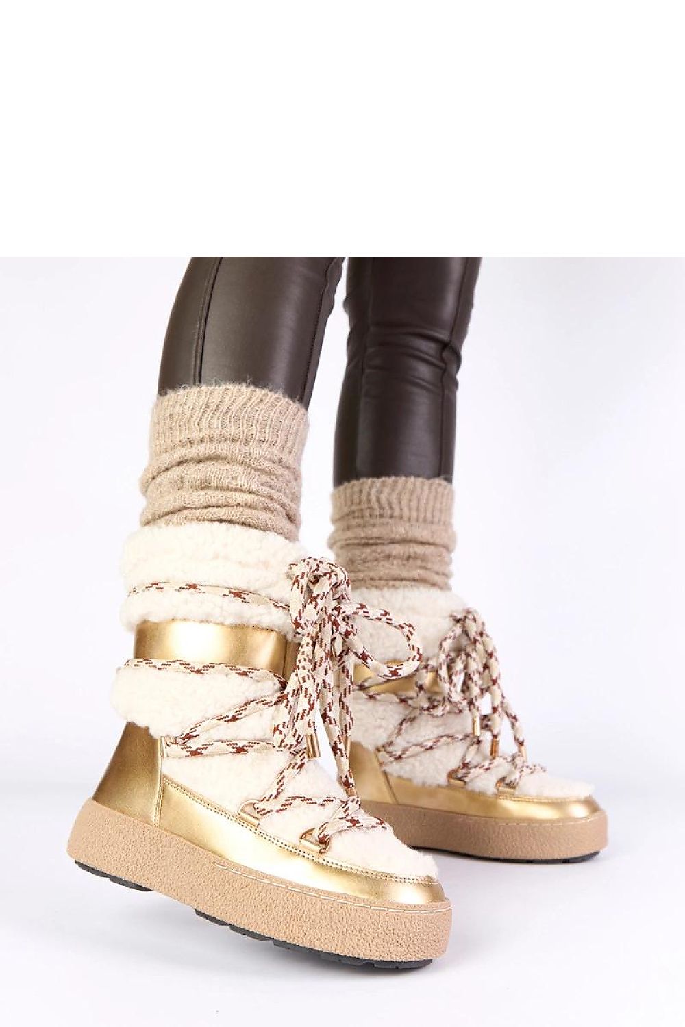 Elegant Solea Luxe Women's Snow Boots in winter setting, highlighting their ankle-high design and sophisticated look for the fashion-forward.