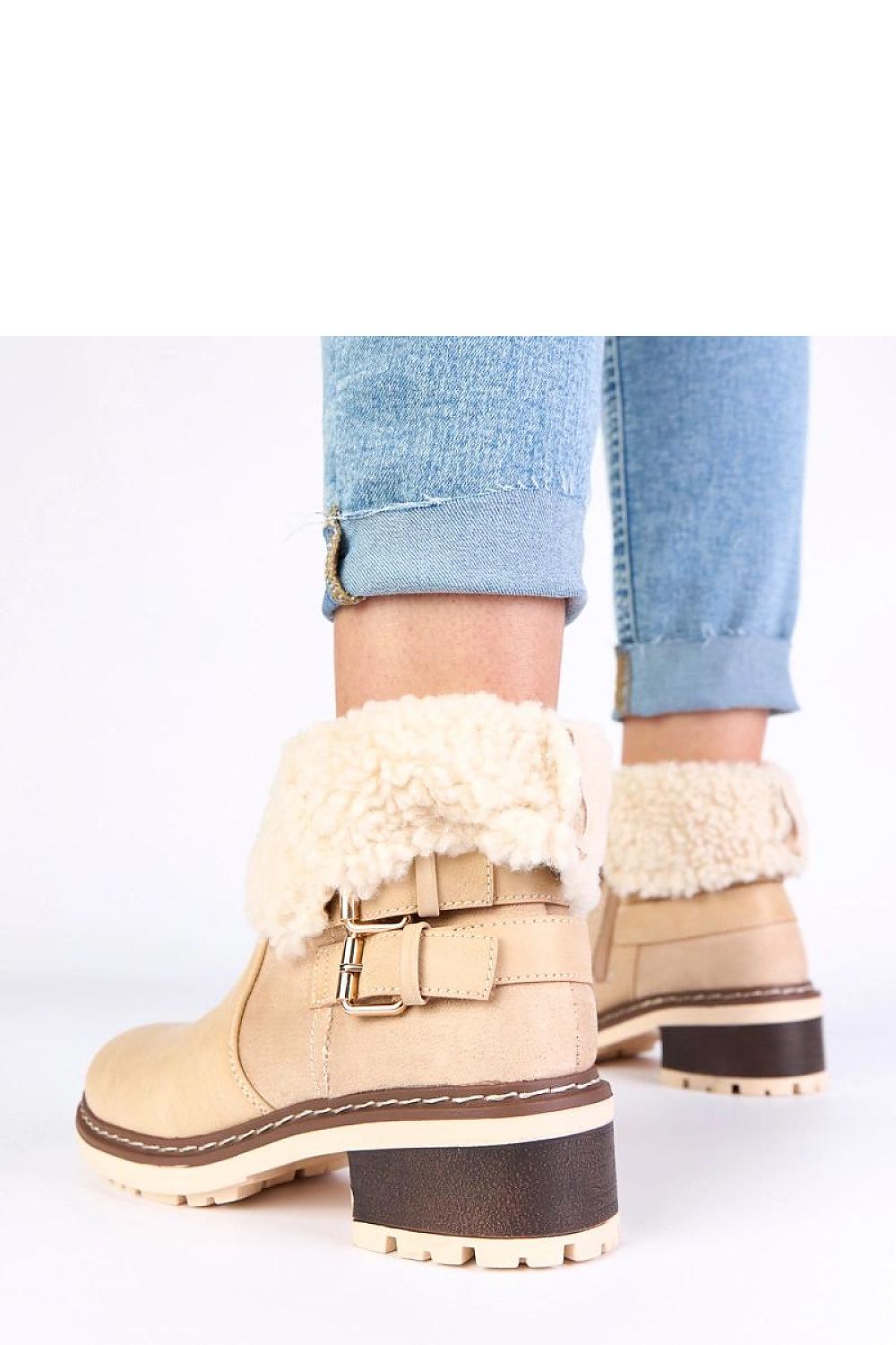 Close-up view of Solea's elegant ankle boots showcasing high-quality synthetic leather and plush fur lining.