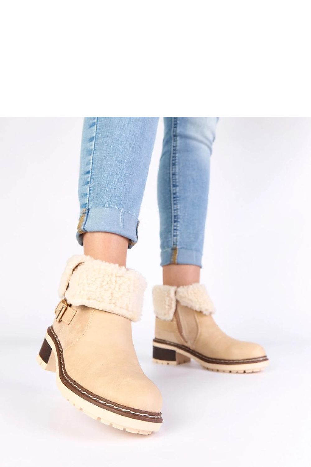 Elegant ankle boots by Solea featuring a comfortable round toe design and 5 cm block heel, ideal for winter elegance.