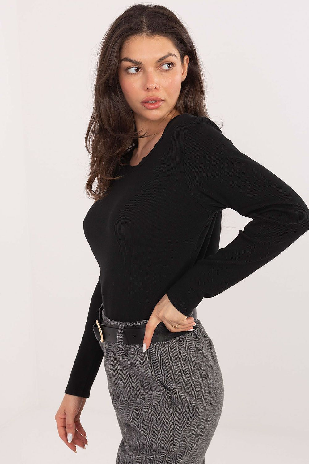 Model wearing Factory Price's elegant ribbed long sleeve blouse, perfect for casual sophistication and suitable for all occasions.
