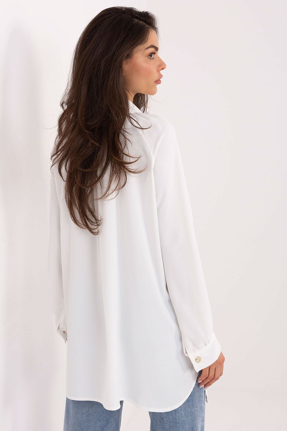 Model wearing the elegant long sleeve women's shirt with puff sleeves by Factory Price, demonstrating versatility in styling for a polished look.