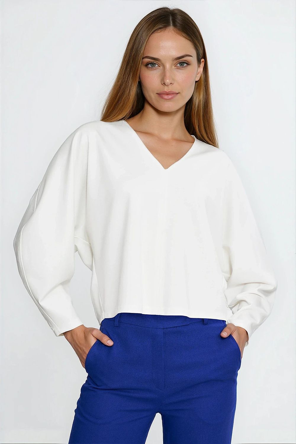 Nife Oversize V-Neck Blouse featuring stylish balloon and batwing sleeves, showcasing luxurious fabric and elegant design in a flattering silhouette.