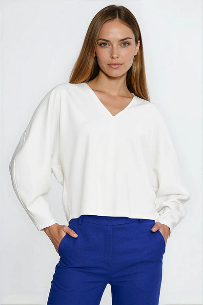 Nife Oversize V-Neck Blouse featuring stylish balloon and batwing sleeves, showcasing luxurious fabric and elegant design in a flattering silhouette.