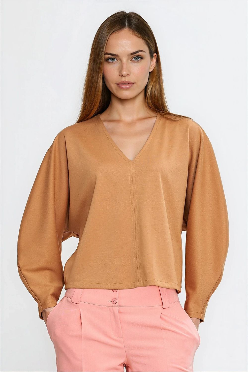Close-up detailing of Nife oversized blouse showcasing the soft viscose fabric and unique v-neck design, offering refined comfort and style.