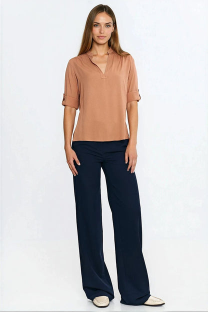 Close-up of Nife Viscose Blouse with adjustable cuffed sleeves, showcasing exquisite pleated details and lightweight fabric.