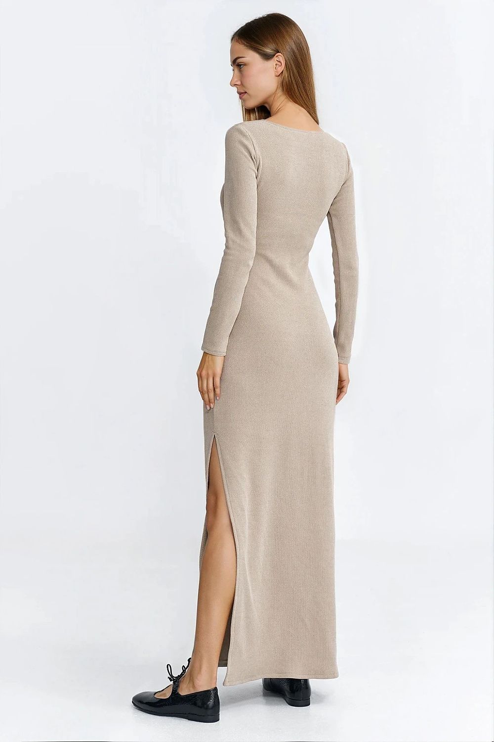 Model wearing the Elegant Maxi Daydress by Nife, demonstrating its flattering silhouette with a side slit and comfortable long sleeves.
