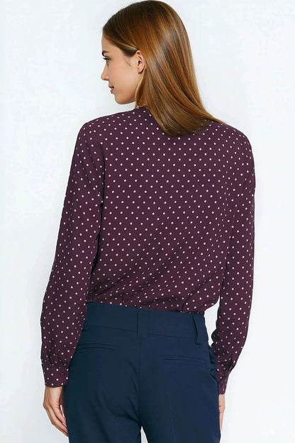 Model showcasing the stylish Silk Polka Dot Long Sleeve Shirt by Nife, paired with tailored trousers for an elegant fall look.