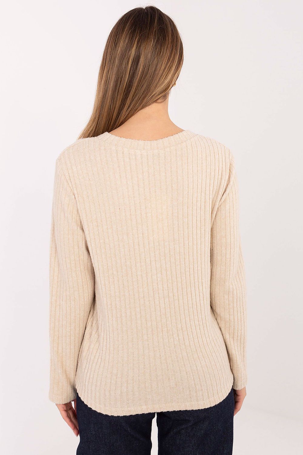A model wearing the Elegant V-Neck Cotton Blend Sweater for Women by Relevance, perfectly paired with trendy jeans for an elevated casual look.