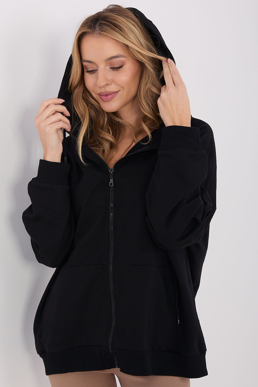 Relevance Luxury Women's Hoodie Sweatshirt styled with jeans, showcasing its elegant design and flattering silhouette for everyday wear.