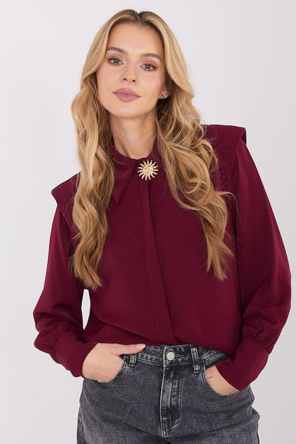 Elegant long sleeve shirt by Italy Moda featuring a classic collar and delicate brooch, perfect for chic styling.
