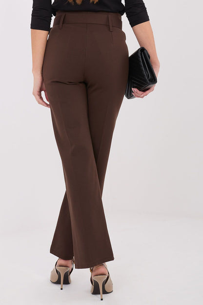 A model flaunting Italy Moda's flattering high waist trousers in various settings, emphasising versatility and style.