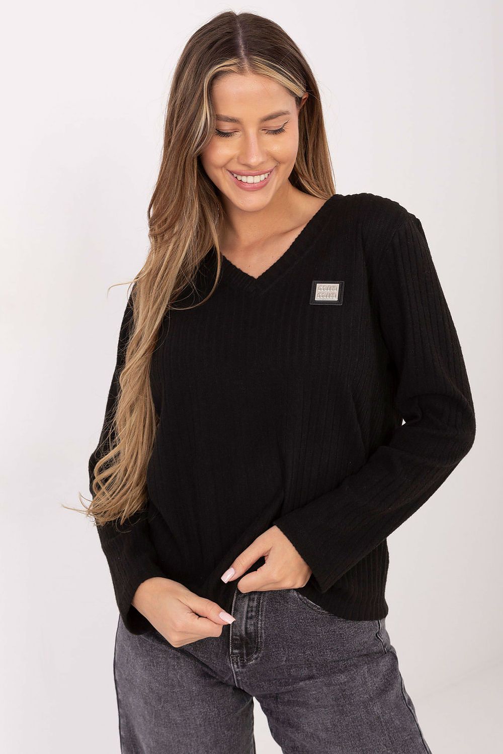 Stylish model wearing the Elegant V-Neck Cotton Blend Sweater by Relevance, perfect for chic everyday wear.