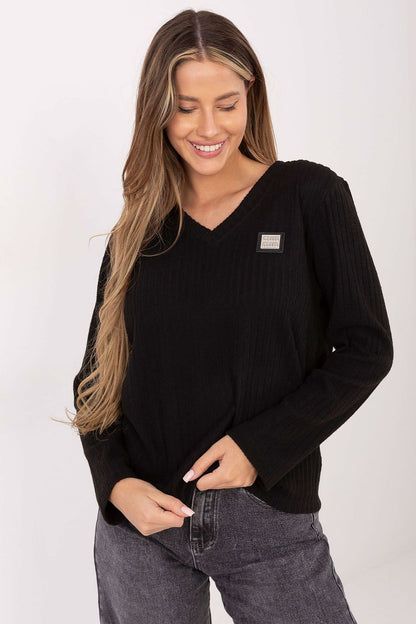 Stylish model wearing the Elegant V-Neck Cotton Blend Sweater by Relevance, perfect for chic everyday wear.