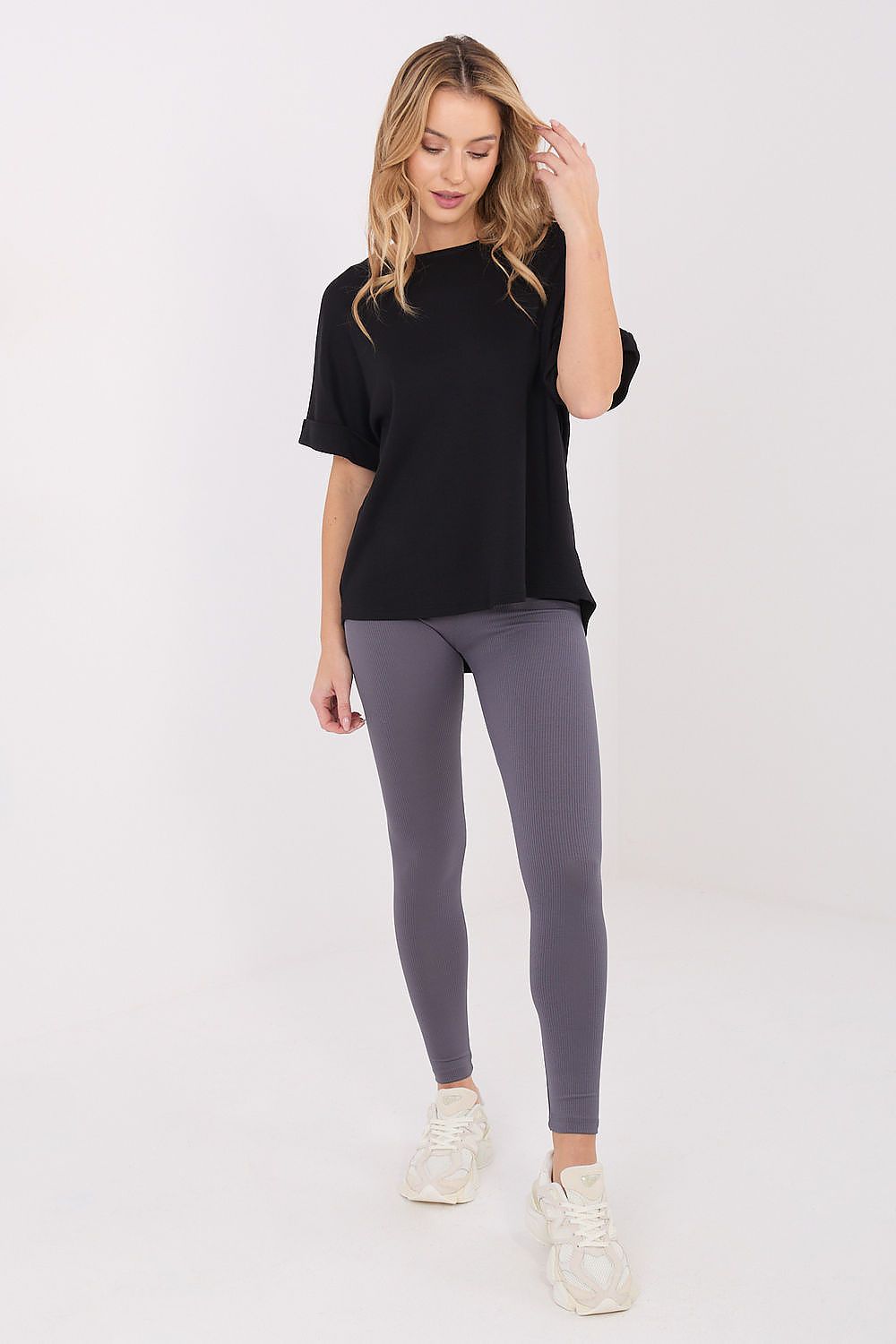 Elegant women's long leggings from Relevance, featuring a high waist and tapered legs for a chic and sophisticated look assured for both sport and casual wear.
