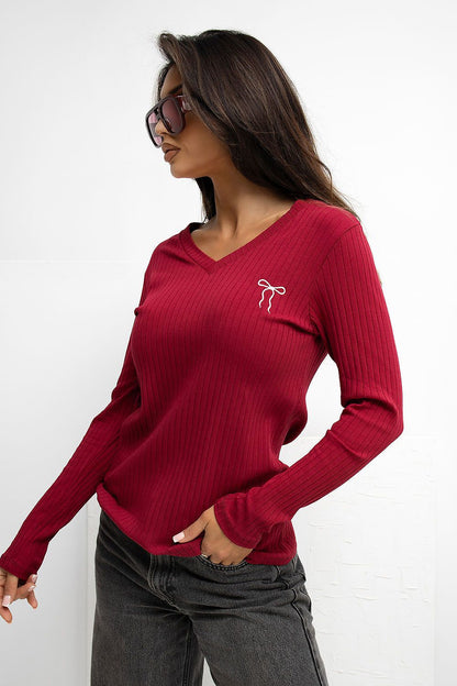 Elegant cotton-spandex blouse from Rue Paris, highlighting its unique embroidery and perfect fit for any occasion.