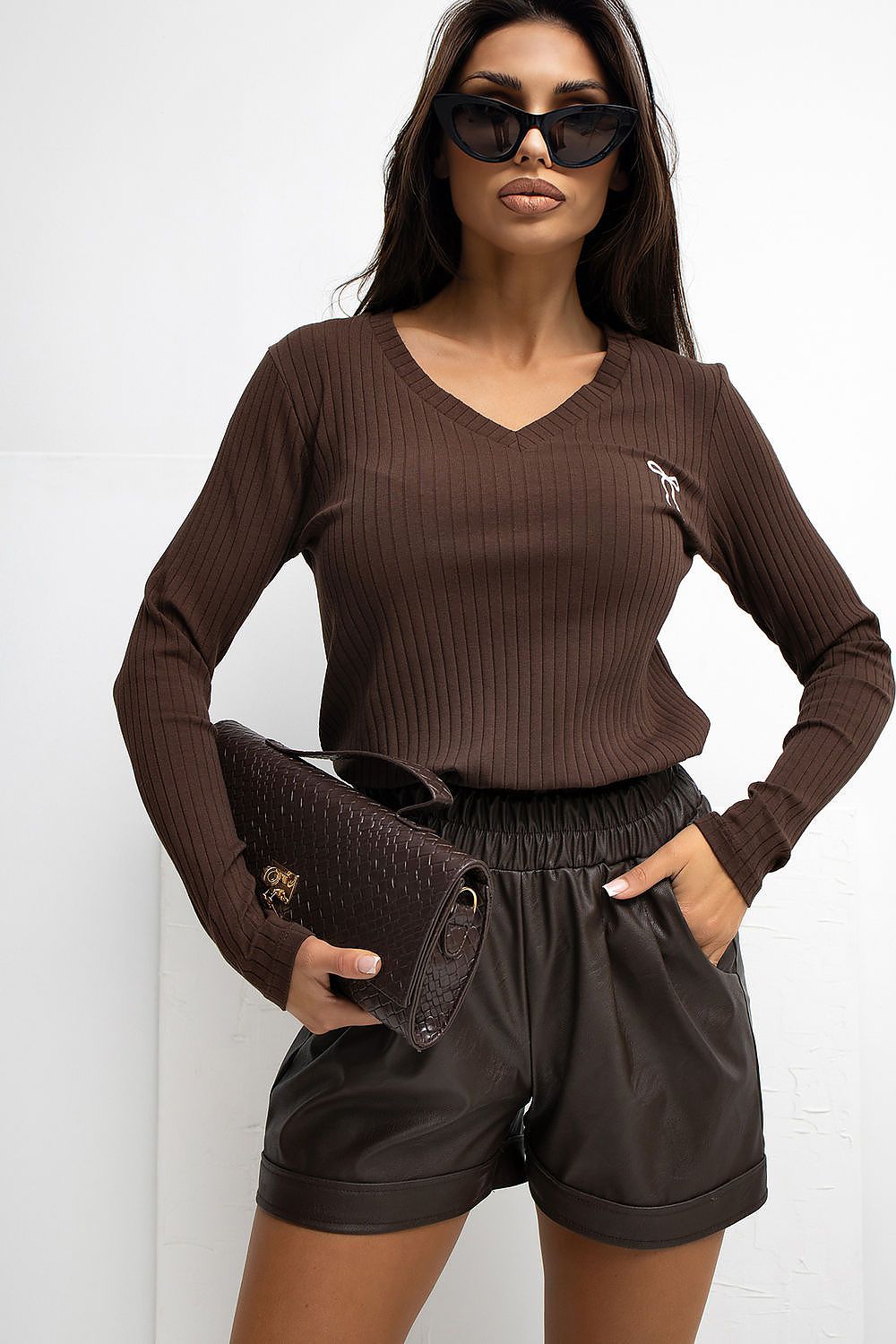 Stylish long sleeve Rue Paris blouse in a modern ribbed texture, showcasing a sophisticated silhouette ideal for versatile everyday wear and elegant occasions.