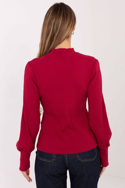 Close-up of Rue Paris blouse highlighting the soft cotton-elastane fabric, elegantly designed with trendy puff sleeves and a chic turtleneck.