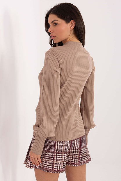 Elegant Rue Paris blouse featuring chic puff sleeves and a sophisticated turtleneck, perfect for daytime or casual office wear.