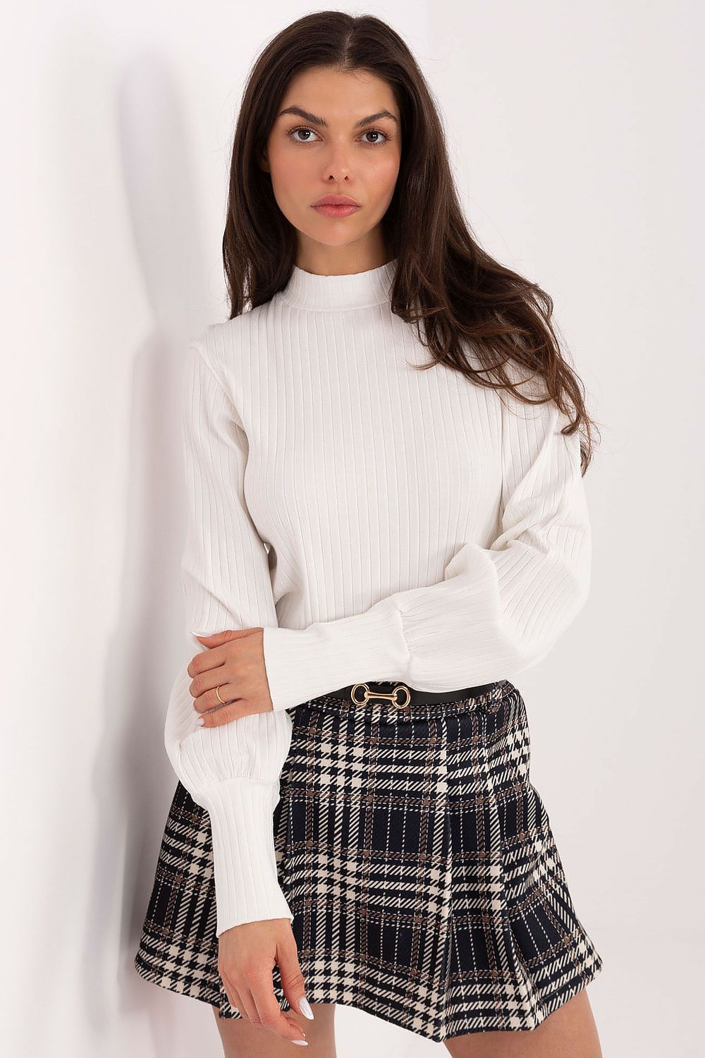 Elegant Rue Paris blouse featuring puff sleeves and a subtle turtleneck, styled for a luxurious everyday look.