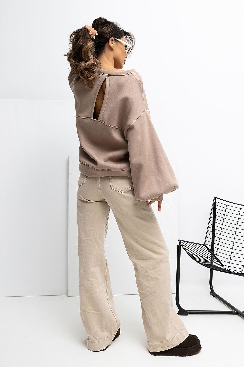 Back view of Rue Paris women's sweatshirt featuring a modern vertical cut, illustrating the sophisticated design and soft cotton blend fabric.