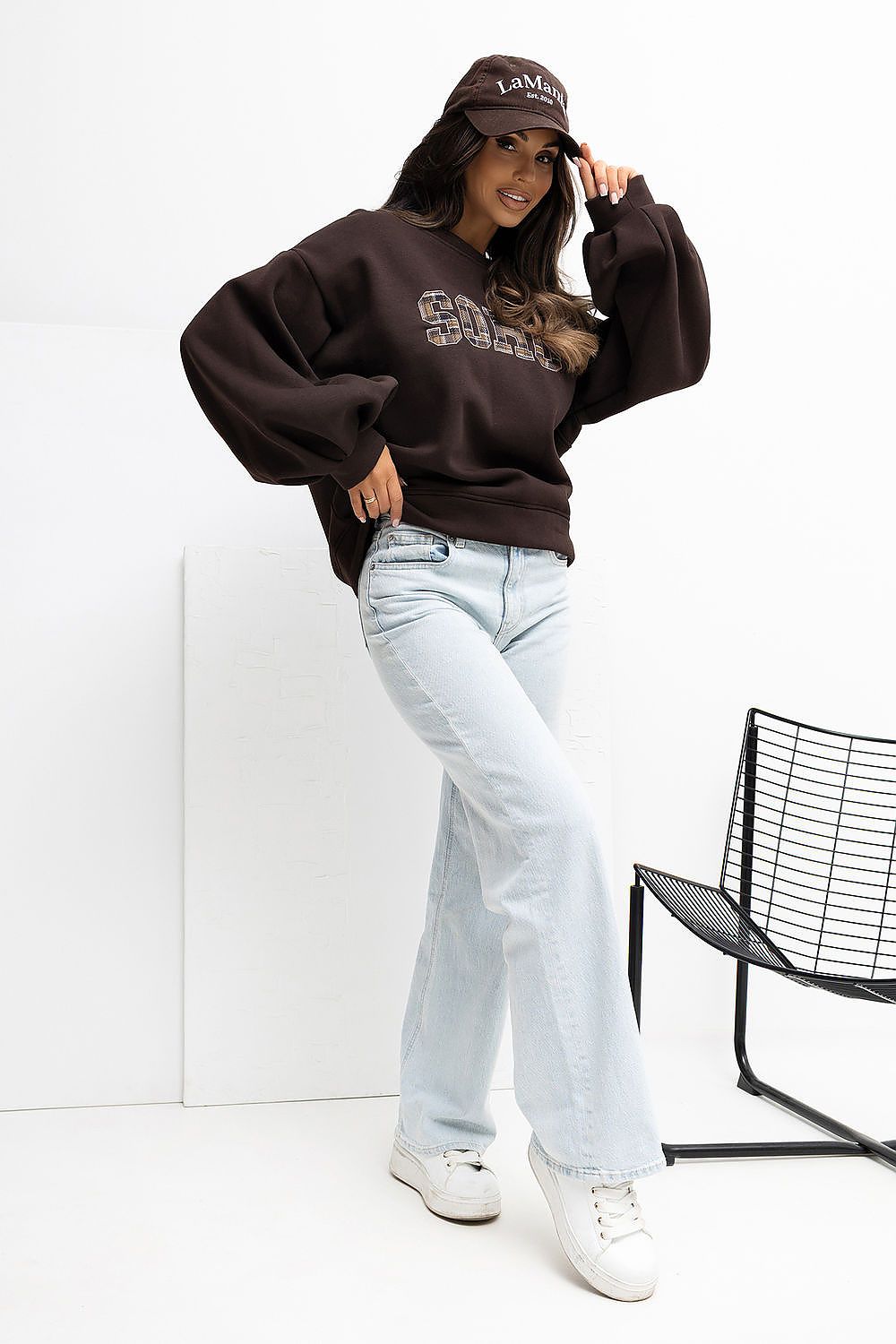 Elegant women's cotton blend sweatshirt by Rue Paris featuring a unique vertical back cut, perfect for stylish everyday wear.