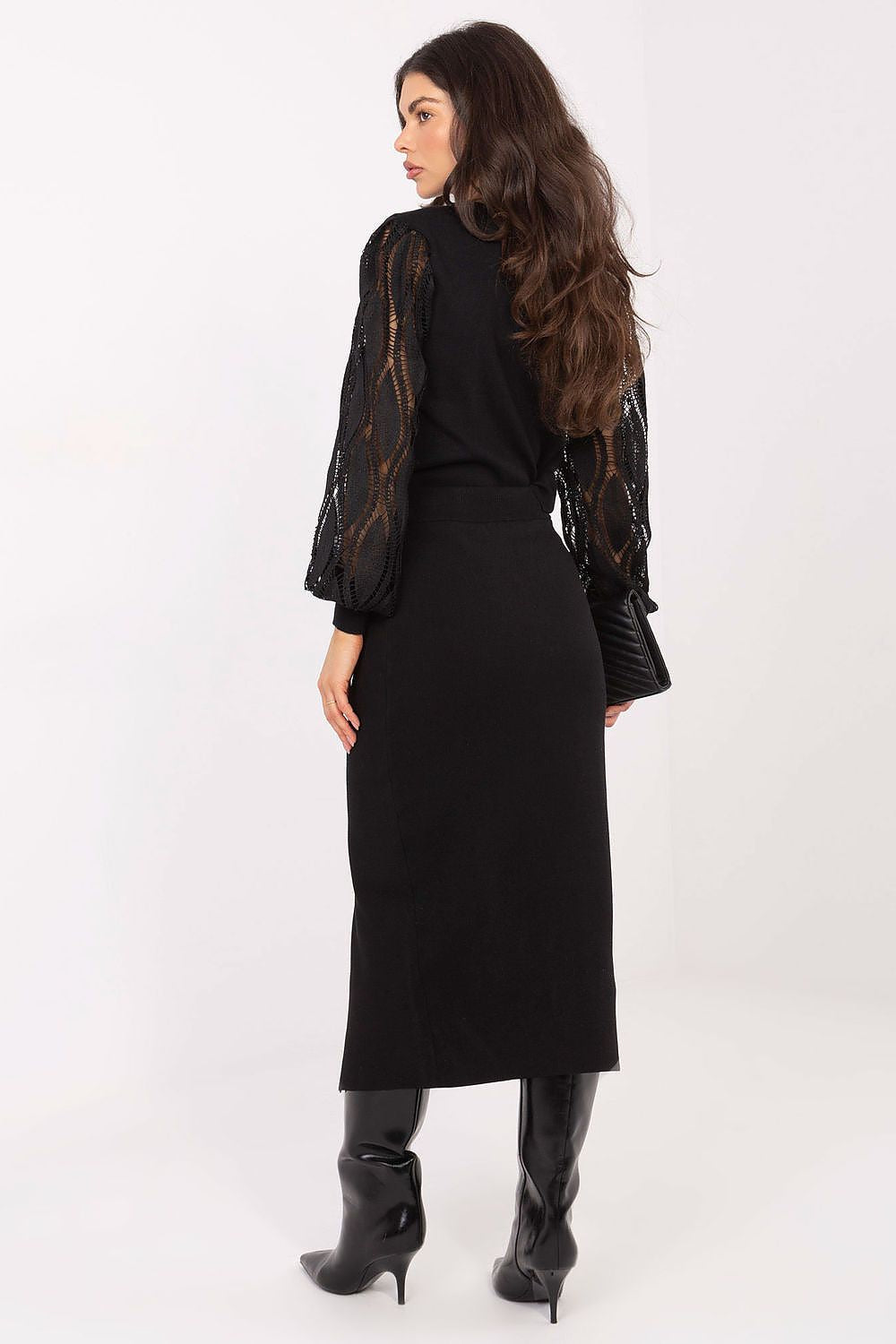 Elegant midi-length knitted skirt with slit and decorative buttons by Factory Price, showcasing a luxurious blend of soft viscose and polyester.