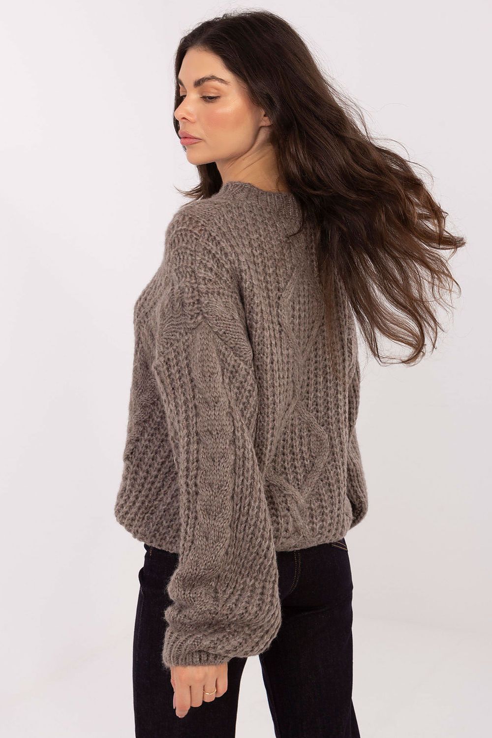 The elegant silhouette of the Luxury Soft Women's Sweater by Factory Price, highlighting its loose fit and versatility.
