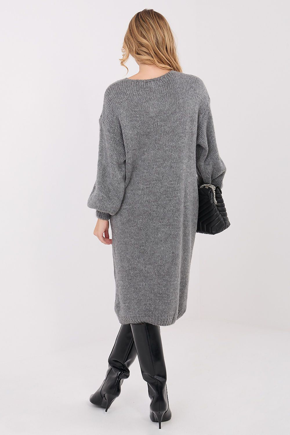 Stylish display of Factory Price's oversized knit midi sweater dress with v-neck and long sleeves, epitomising comfort and sophistication for daily wear.