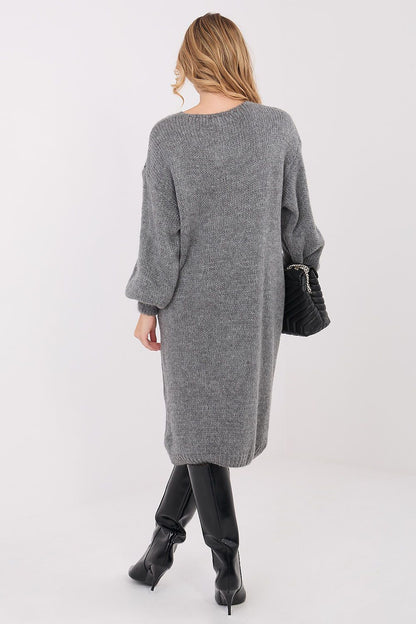 Stylish display of Factory Price's oversized knit midi sweater dress with v-neck and long sleeves, epitomising comfort and sophistication for daily wear.